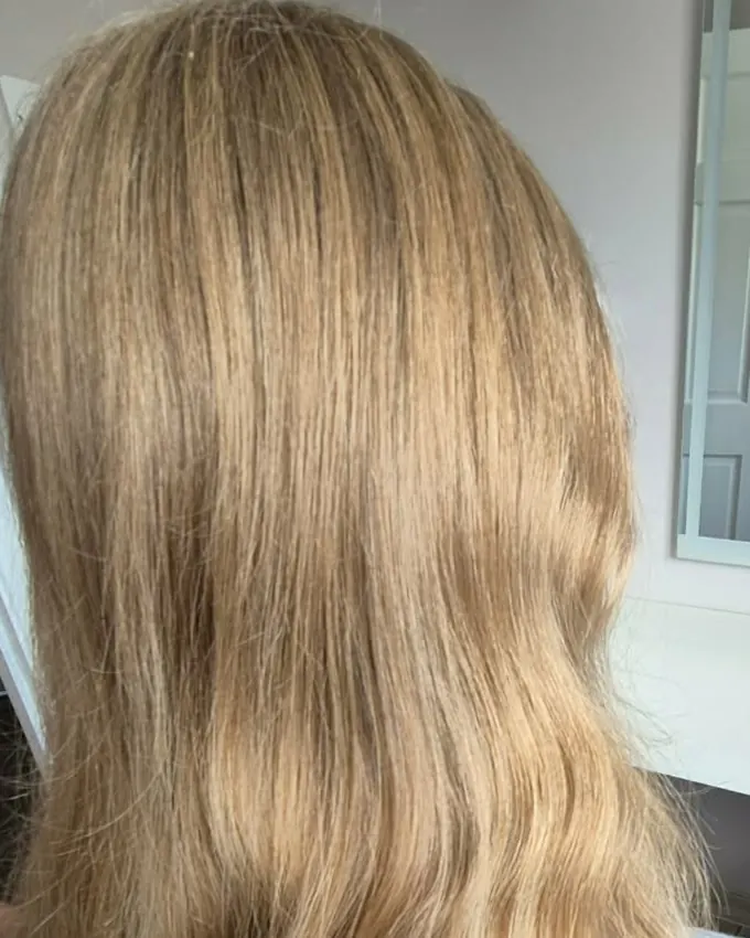 Long blond hair, dull and lacking definition